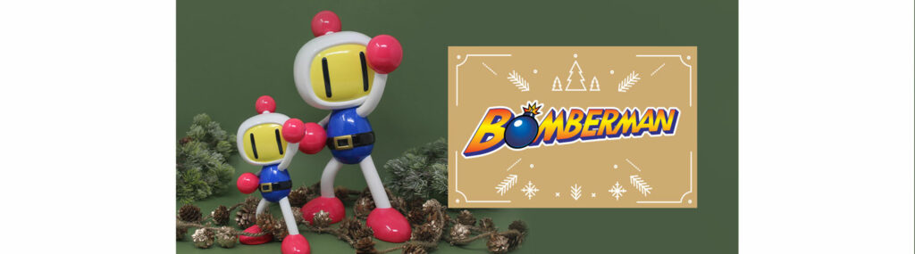Pour une idée cadeau de Noël parfaite : les figurines de Bomberman par Neamedia Icons. Deux modèle exposés, une de 15 centimètres et une autre de 25 cm. Les deux sont dans les couleurs originales, le logo est à droite.